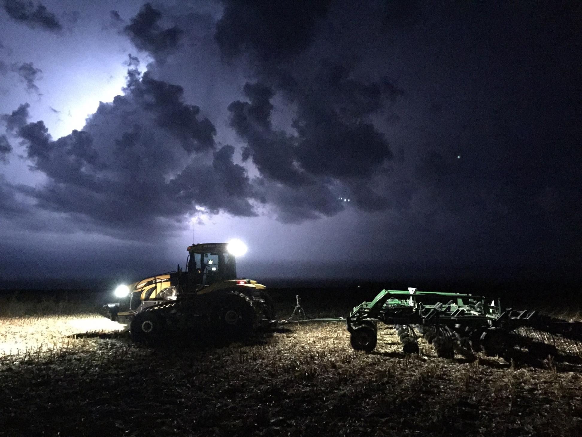 Tractor in Field at Night