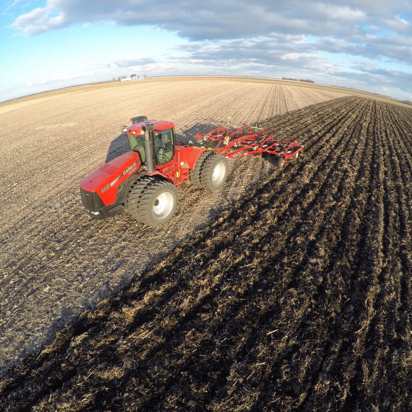 Tractor Plowing Field